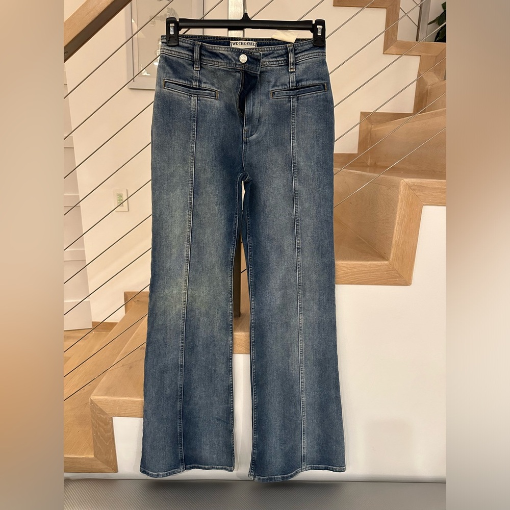 Free people flare jeans with red stars on the back